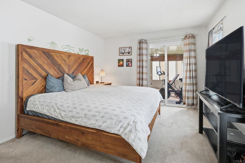 270 Chestnut Way Oceanside, CA 92057 - Photo 16 of 43 a bedroom with a bed and a flat screen tv