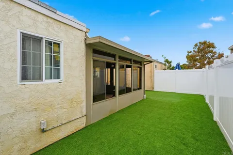 a view of backyard with cabin