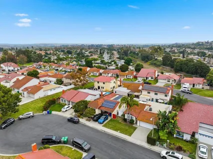 an aerial view of residential houses with outdoor space