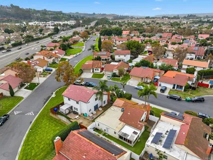 an aerial view of residential houses with outdoor space