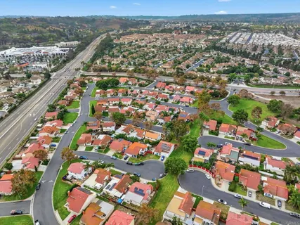 an aerial view of city and lake