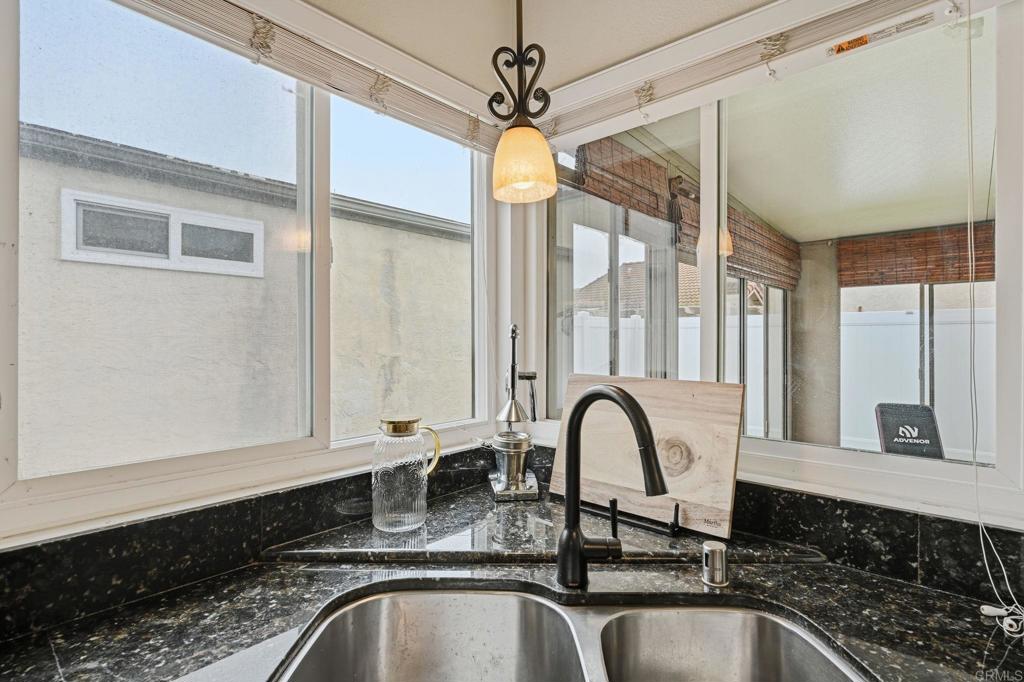 270 Chestnut Way Oceanside, CA 92057 - Photo 6 of 43 a close view of a sink a faucet and a window