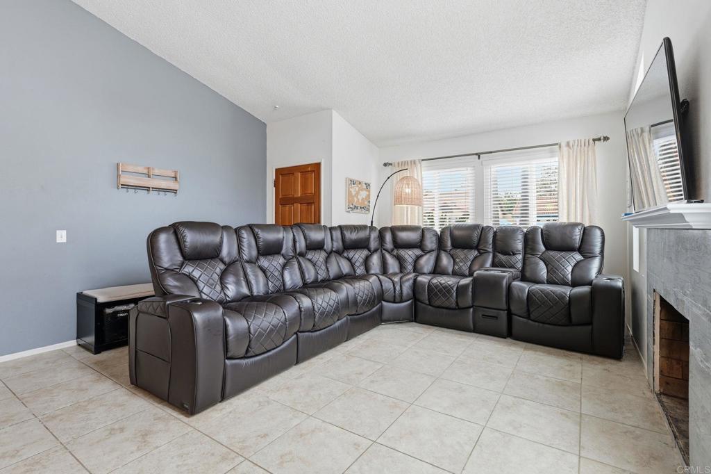 270 Chestnut Way Oceanside, CA 92057 - Photo 9 of 43 a living room with furniture and a large window