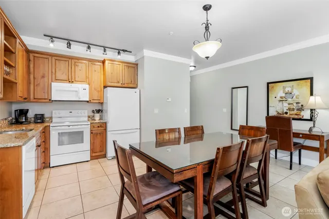a bathroom with a granite countertop double vanity sink and a mirror