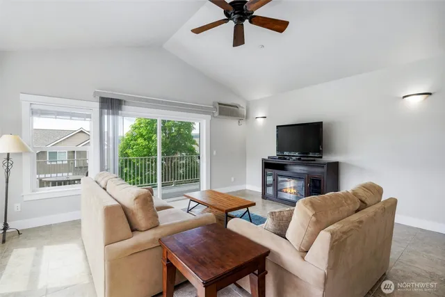 a kitchen with stainless steel appliances granite countertop a stove and a refrigerator