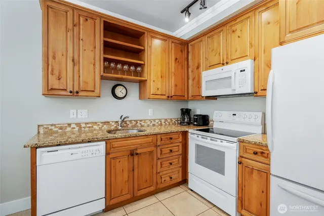 a bedroom with a bed and flat screen tv