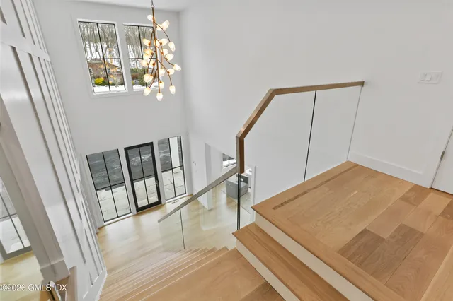 a spacious bathroom with a granite countertop sink mirror and shower