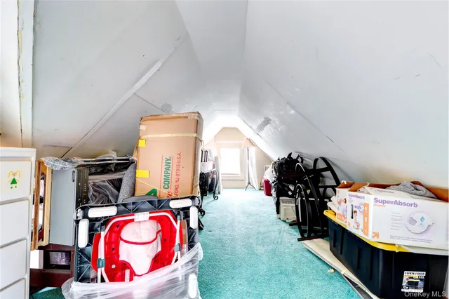 a bedroom with bed and storage