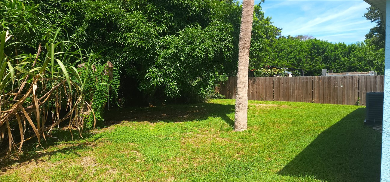 1860 38th Street Vero Beach, FL 32960 - Photo 3 of 8 a view of a backyard with wooden fence