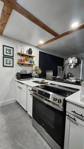 a kitchen with a stove and a microwave