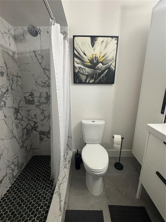 1935 South Conway Road, Unit T6 Orlando, FL 32812 - Photo 21 of 33 a bathroom with a toilet and a shower