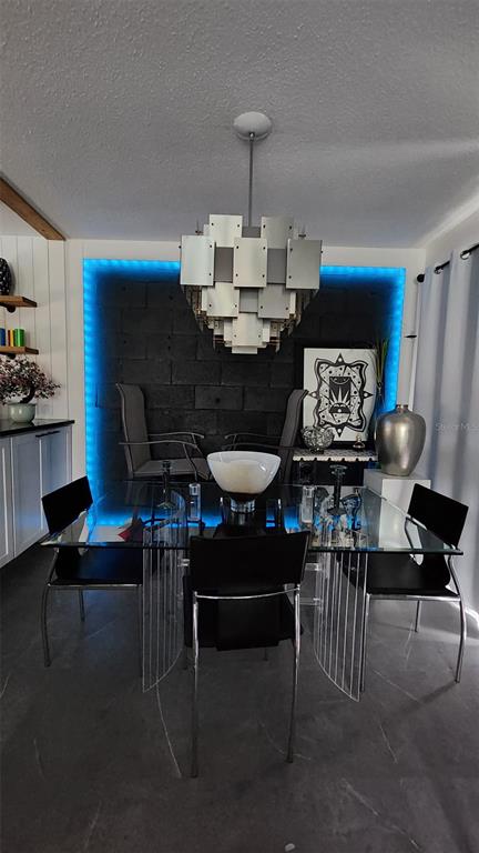 1935 South Conway Road, Unit T6 Orlando, FL 32812 - Photo 26 of 33 a living room with furniture a rug and a table