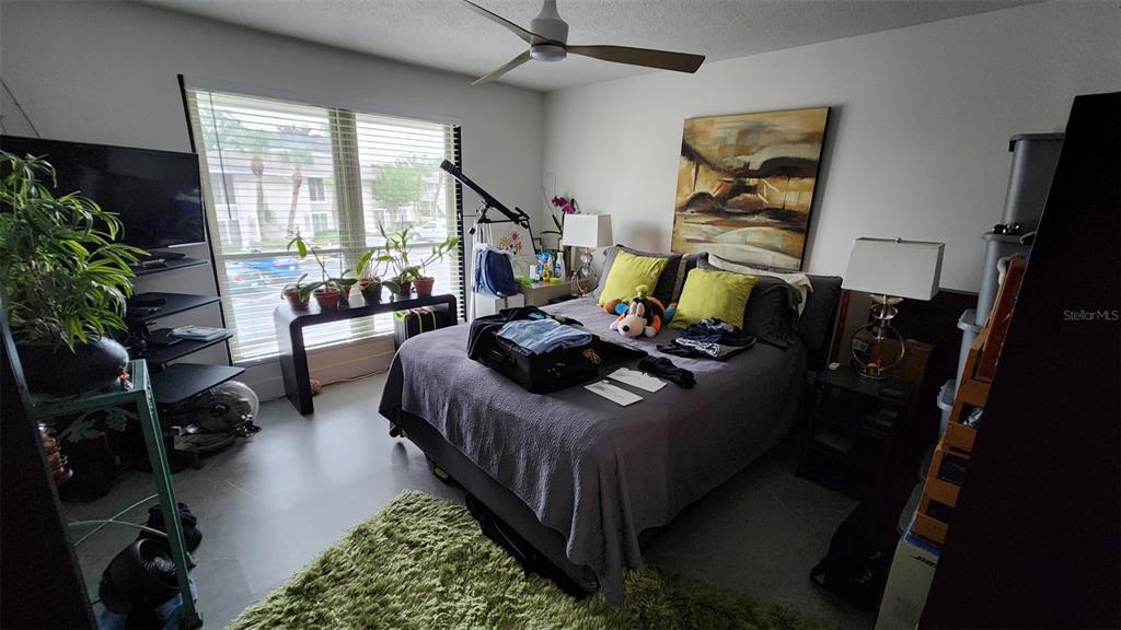 1935 South Conway Road, Unit T6 Orlando, FL 32812 - Photo 27 of 33 a living room with furniture rug and a large window