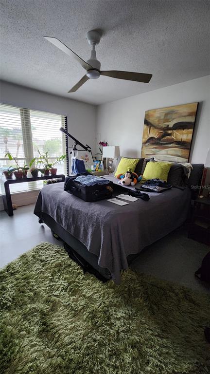 1935 South Conway Road, Unit T6 Orlando, FL 32812 - Photo 28 of 33 a living room with furniture and a large window