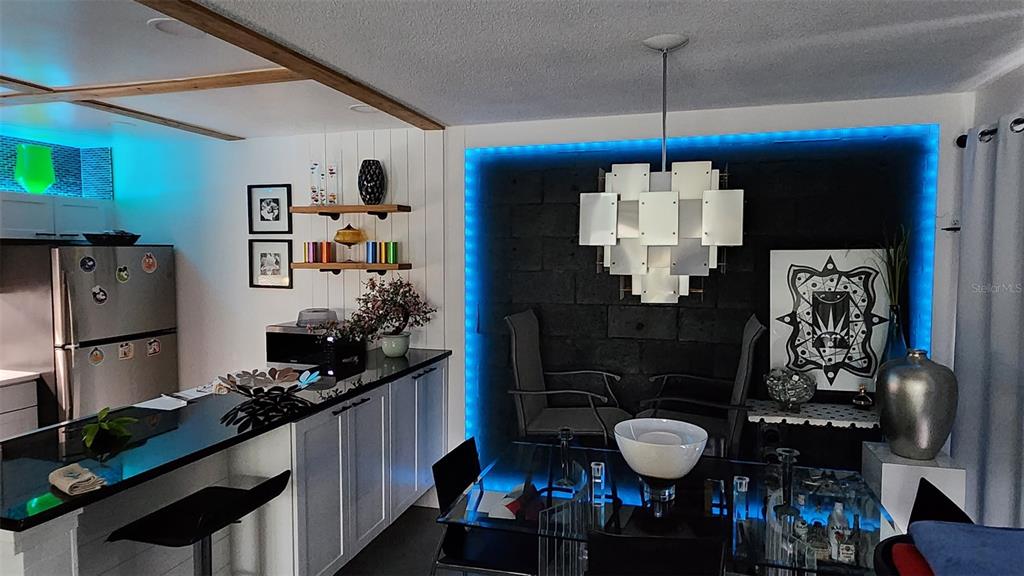 1935 South Conway Road, Unit T6 Orlando, FL 32812 - Photo 7 of 33 a kitchen with stainless steel appliances granite countertop a sink stove and refrigerator