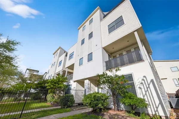 a view of a building with a yard