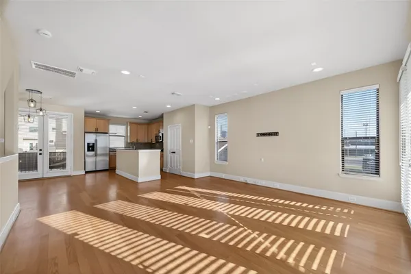 a view of a livingroom with kitchen and furniture