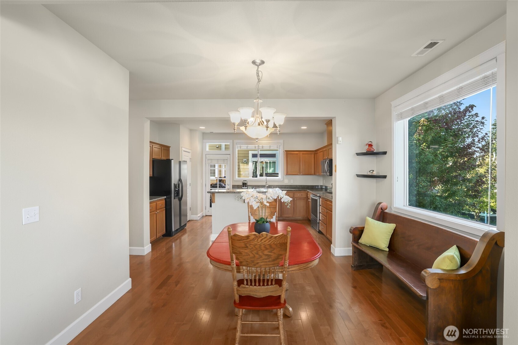 142 Spruce Street Tacoma, WA 98466 - Photo 11 of 31 a view of a dining room with furniture a chandelier and wooden floor