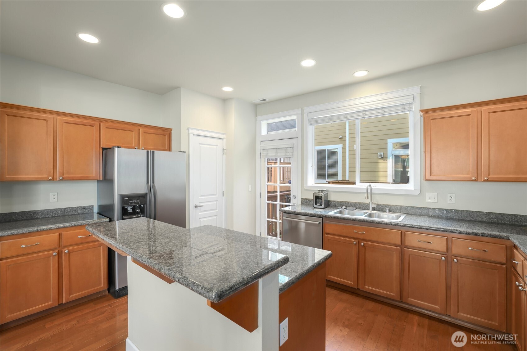 142 Spruce Street Tacoma, WA 98466 - Photo 13 of 31 a kitchen with stainless steel appliances granite countertop a sink a stove and a refrigerator
