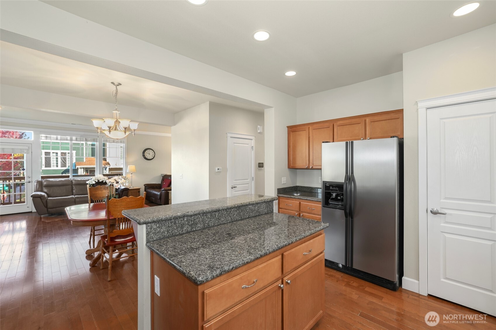 142 Spruce Street Tacoma, WA 98466 - Photo 16 of 31 a kitchen with stainless steel appliances granite countertop a refrigerator and wooden floor