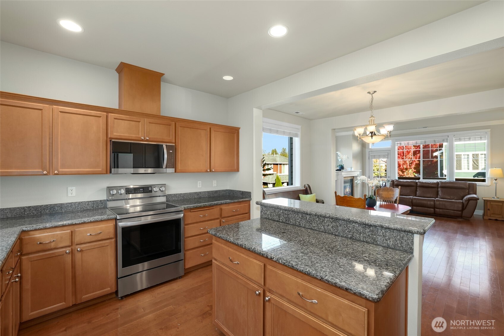 142 Spruce Street Tacoma, WA 98466 - Photo 17 of 31 a kitchen with stainless steel appliances granite countertop a sink stove and refrigerator