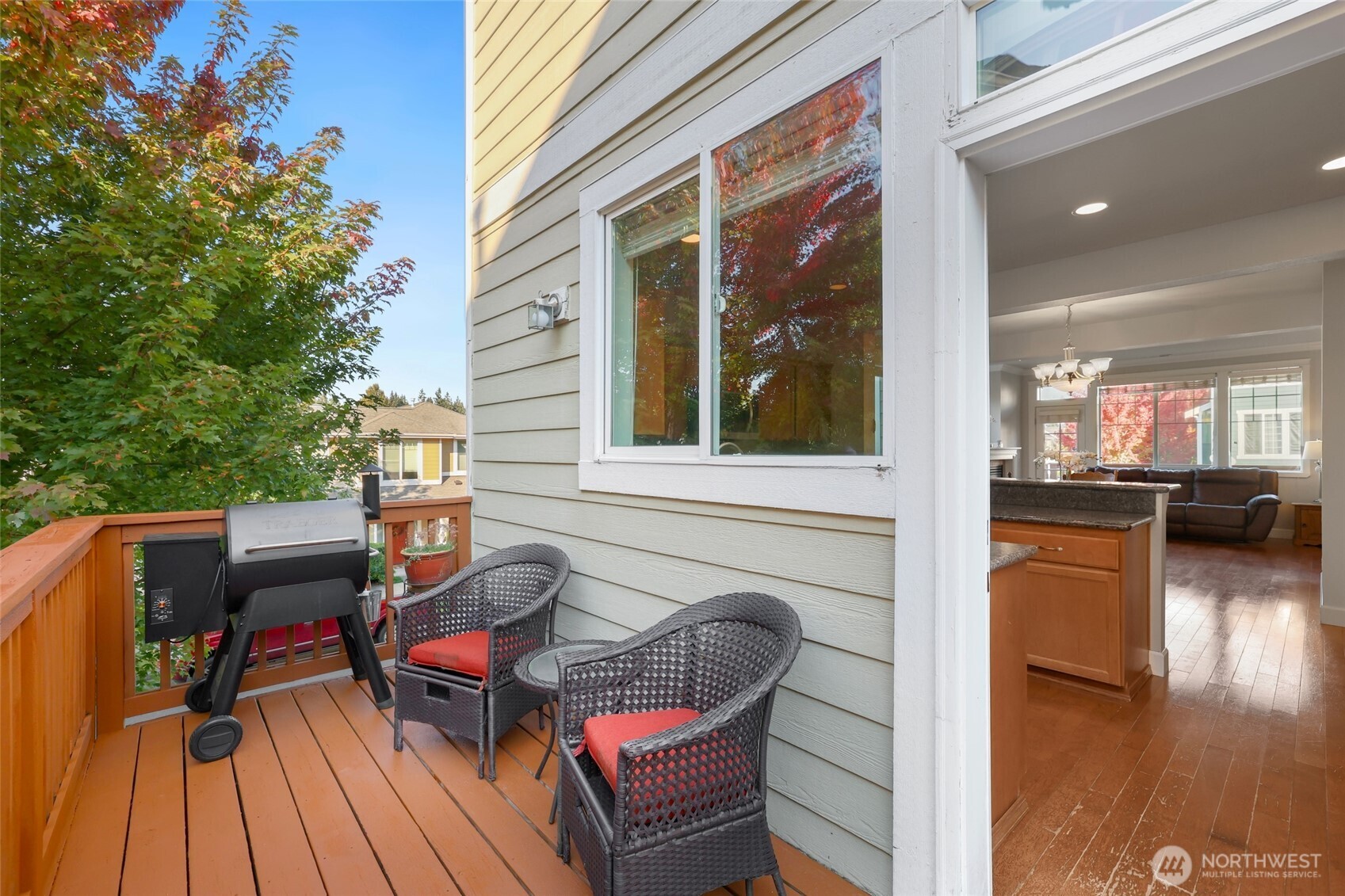 142 Spruce Street Tacoma, WA 98466 - Photo 18 of 31 a balcony with wooden floor and outdoor seating