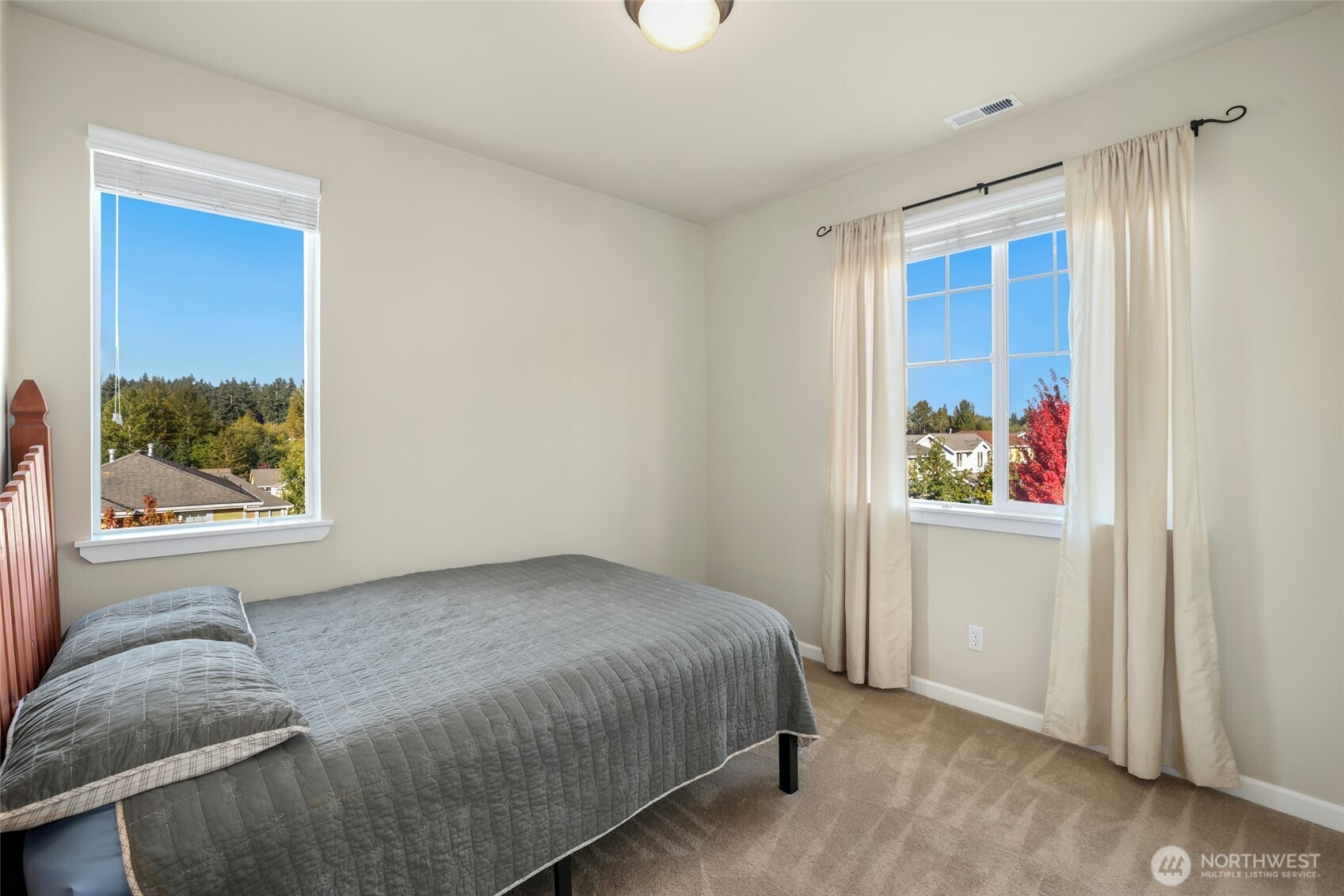 142 Spruce Street Tacoma, WA 98466 - Photo 23 of 31 a bedroom with a bed and a window
