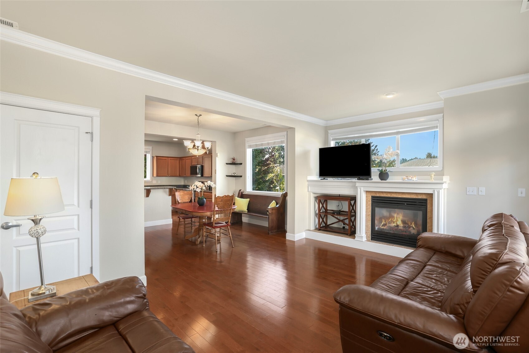 142 Spruce Street Tacoma, WA 98466 - Photo 6 of 31 a living room with furniture a fireplace and a flat screen tv
