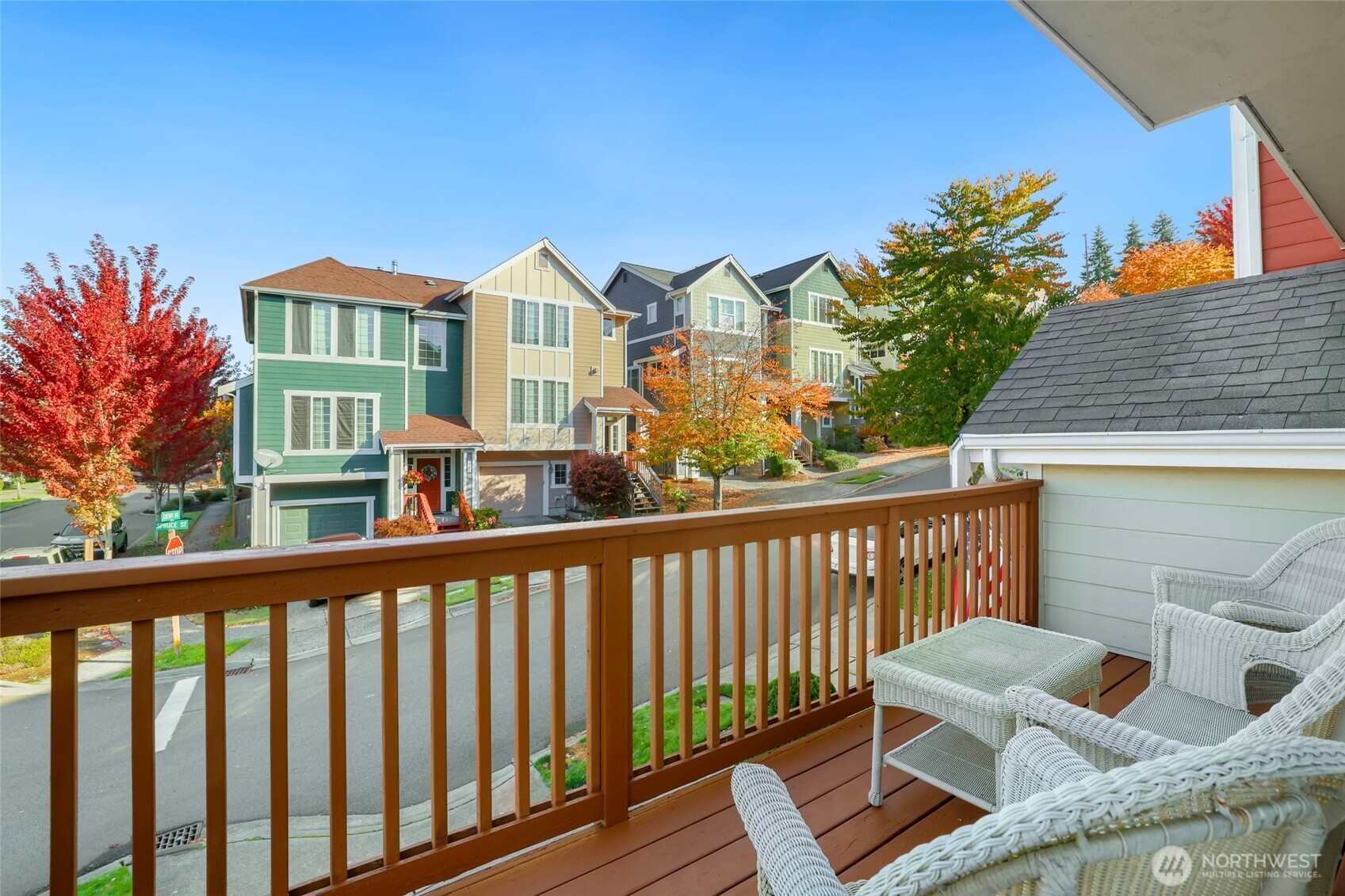 142 Spruce Street Tacoma, WA 98466 - Photo 8 of 31 a view of a balcony with chairs and wooden fence