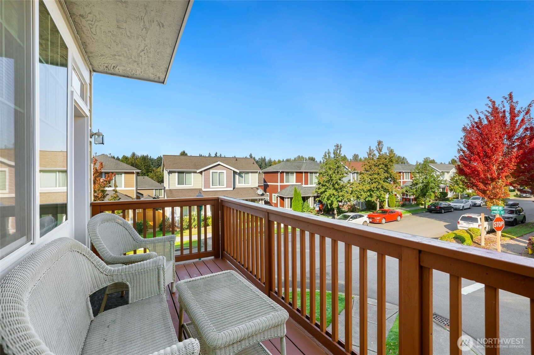 142 Spruce Street Tacoma, WA 98466 - Photo 9 of 31 a view of a balcony with two chairs and wooden fence