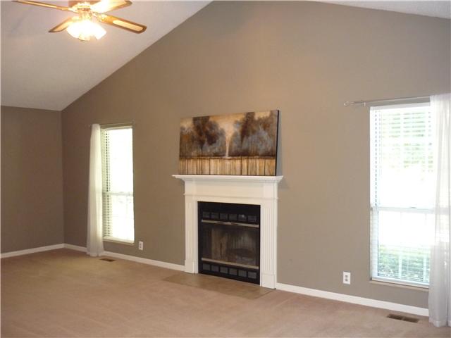 Large Living Room with Wood Burning Fireplace with New Chimney Cap. Cathedral Ceiling. Ceiling Fans and Plantation Blinds Found Throughout Home. Carpets Professionally Cleaned when Listed.