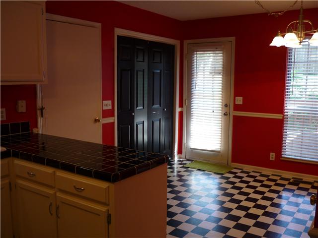 1449 Hunters Branch Road Antioch, TN 37013 - Photo 8 of 13 Large Eat-in Kitchen with New Chrome Light Fixture. Easy Acess to Back Deck, Utility Closet, Garage and Studio/Office.