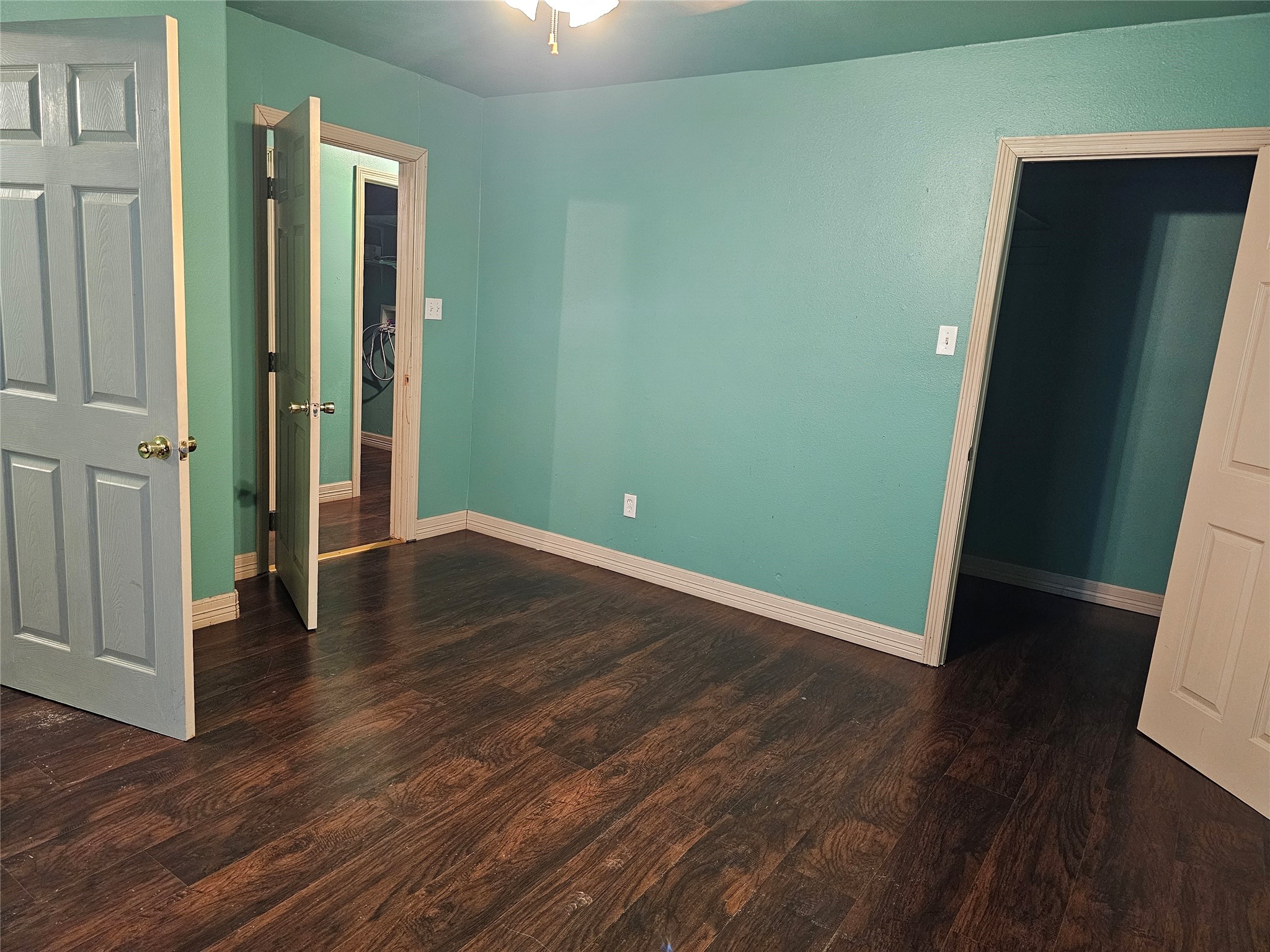 20146 Highway 35 Sweeny, TX 77480 - Photo 12 of 44 an empty room with wooden floor and entrance