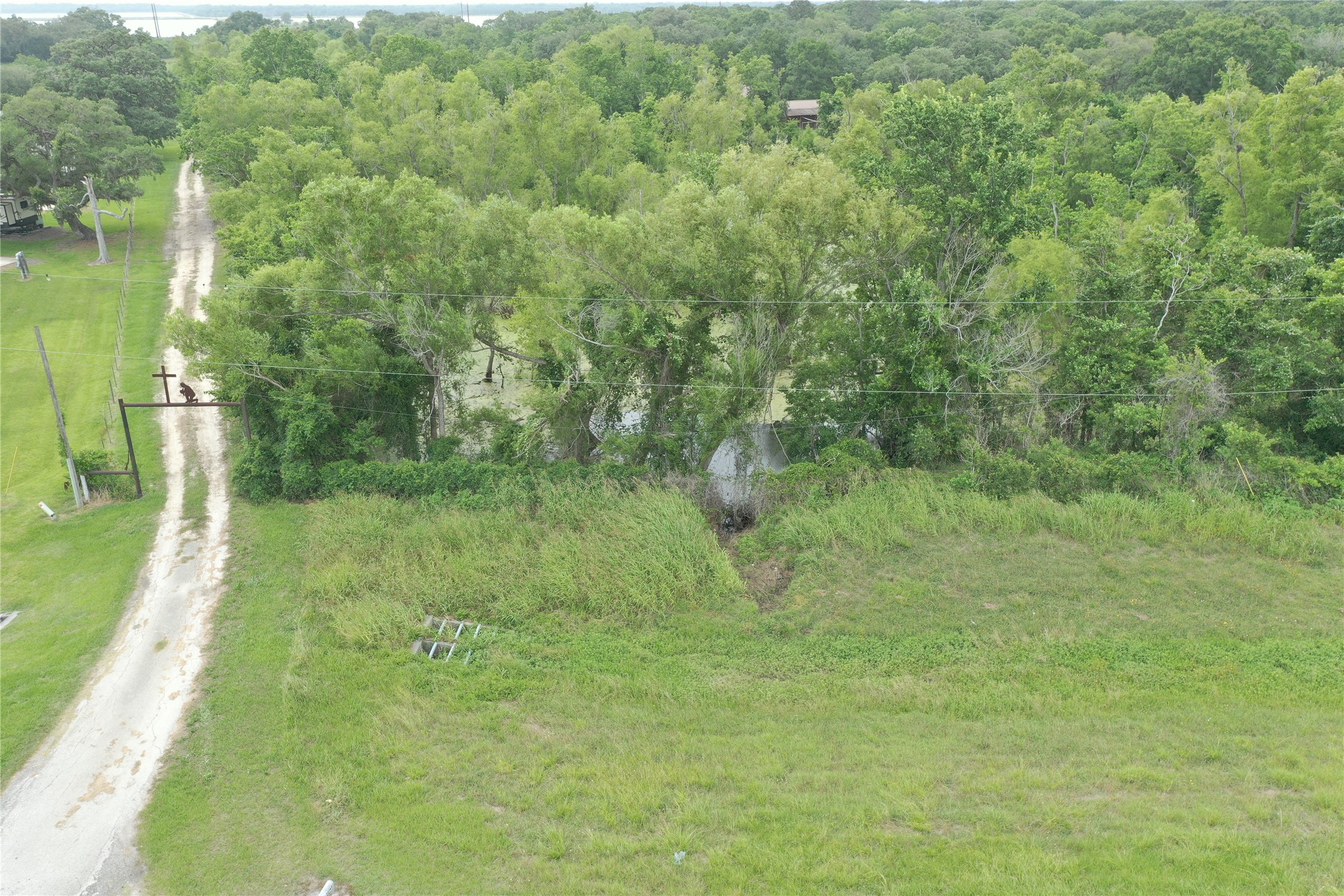 20146 Highway 35 Sweeny, TX 77480 - Photo 37 of 44 a view of a lush green space