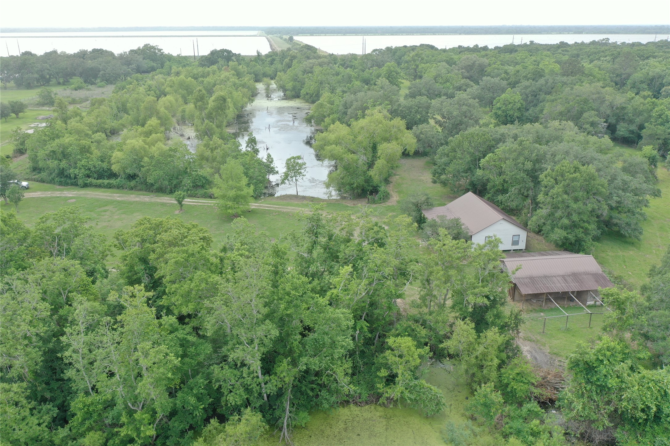 20146 Highway 35 Sweeny, TX 77480 - Photo 39 of 44 an aerial view of a house with yard