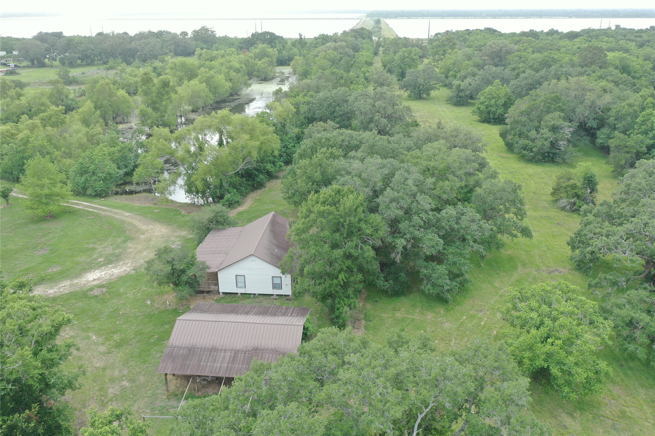 20146 Highway 35 Sweeny, TX 77480 - Photo 40 of 44 an aerial view of a house with a yard