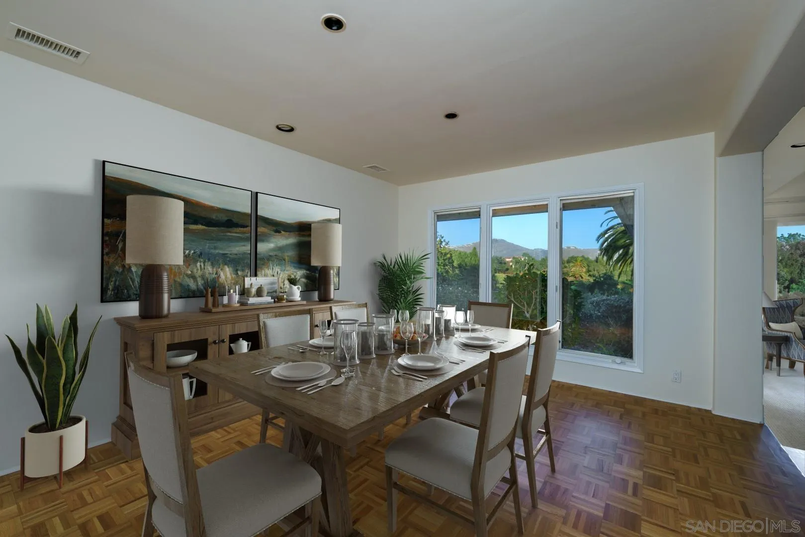 6531 Lago Lindo Rancho Santa Fe, CA 92067 - Photo 13 of 53 a dining room with furniture wooden floor and a potted plant