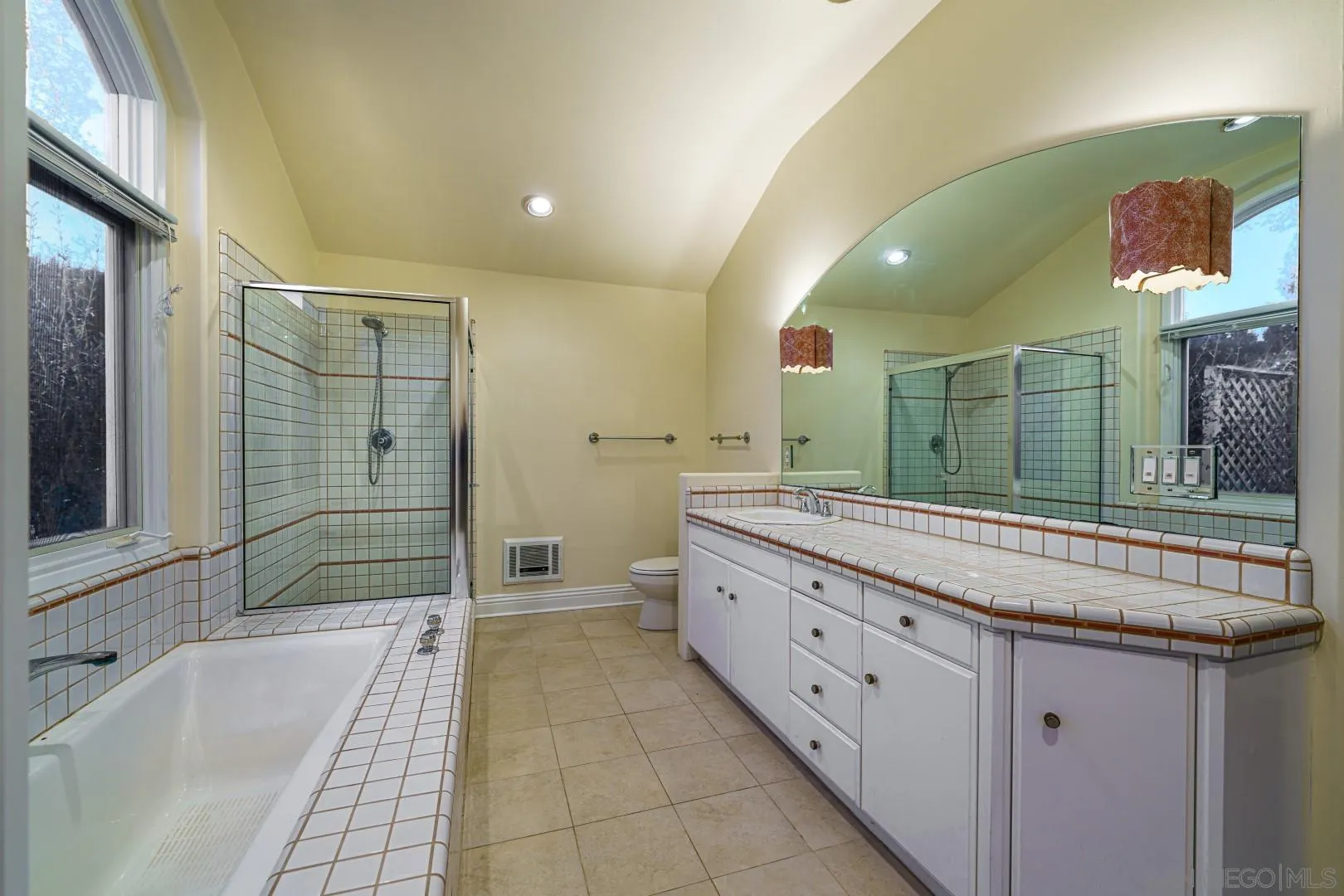 6531 Lago Lindo Rancho Santa Fe, CA 92067 - Photo 19 of 53 a bathroom with a granite countertop sink mirror and bathtub