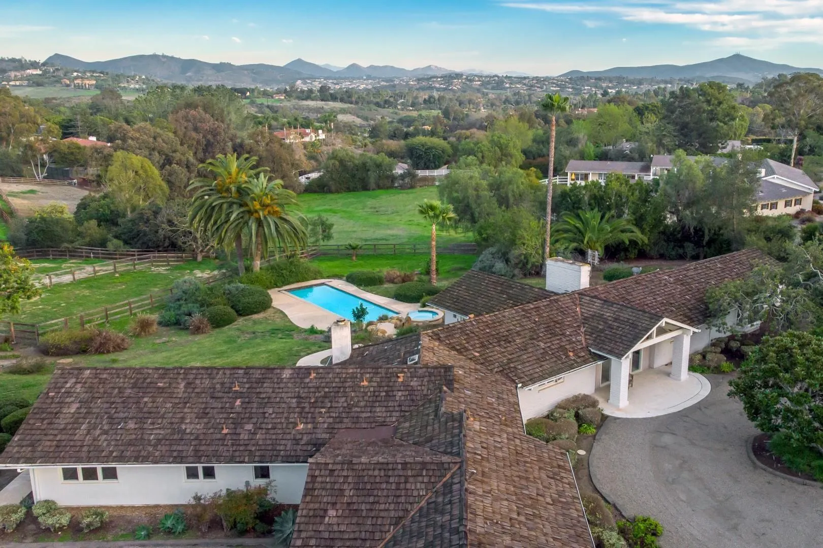 6531 Lago Lindo Rancho Santa Fe, CA 92067 - Photo 41 of 53 an aerial view of a house with a yard and lake