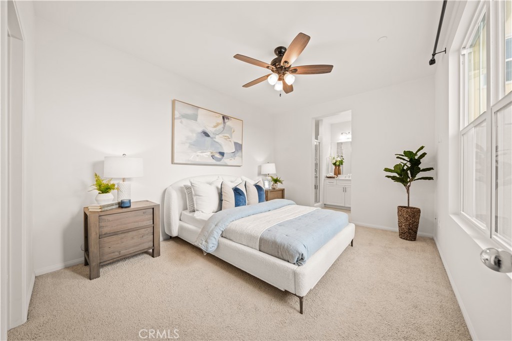 161 Fixie Irvine, CA 92618 - Photo 14 of 47 a bedroom with a bed and a chandelier