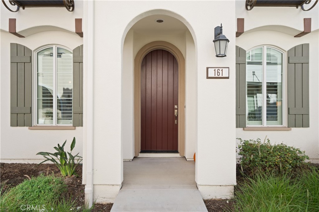 161 Fixie Irvine, CA 92618 - Photo 3 of 47 a front view of a house with large windows