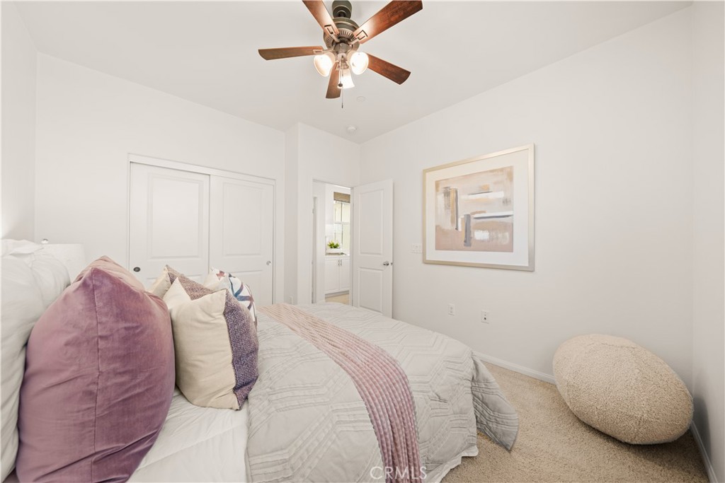 161 Fixie Irvine, CA 92618 - Photo 33 of 47 a bedroom with a bed and a chandelier