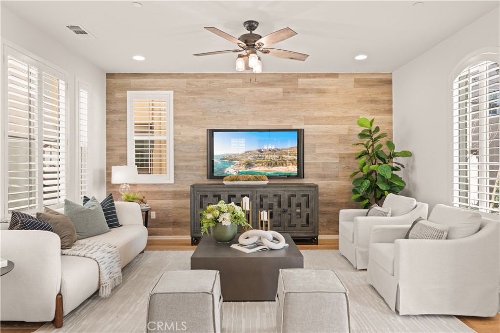 161 Fixie Irvine, CA 92618 - Photo 4 of 47 a living room with furniture chandelier and a fireplace