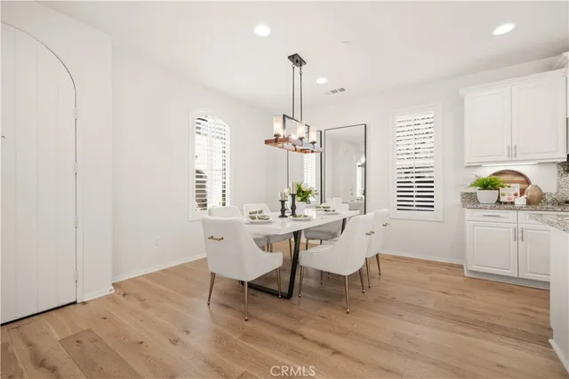a view of a workspace with furniture and window