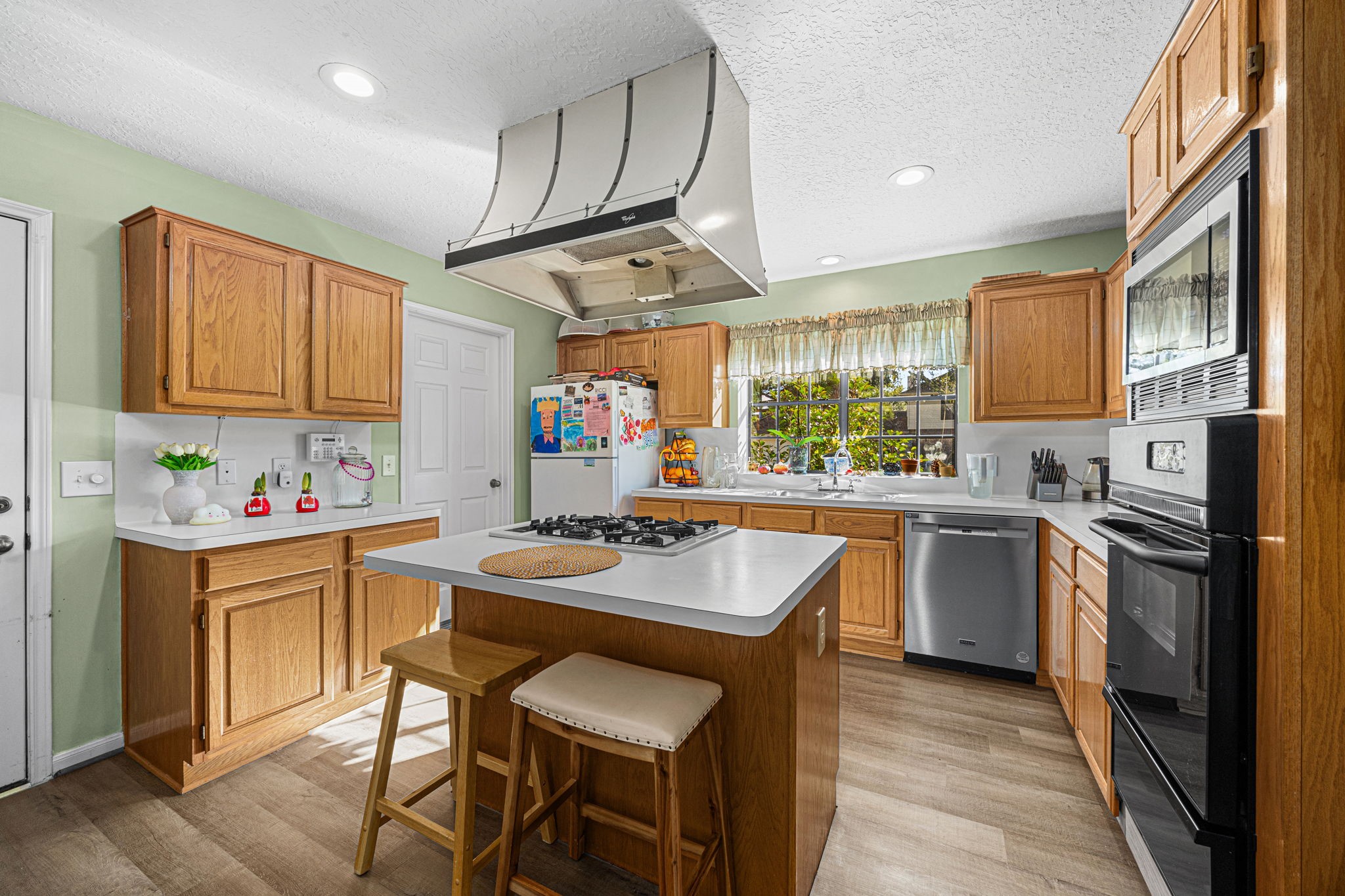 3402 Deeds Road Houston, TX 77084 - Photo 13 of 35 a kitchen with a sink stove and refrigerator