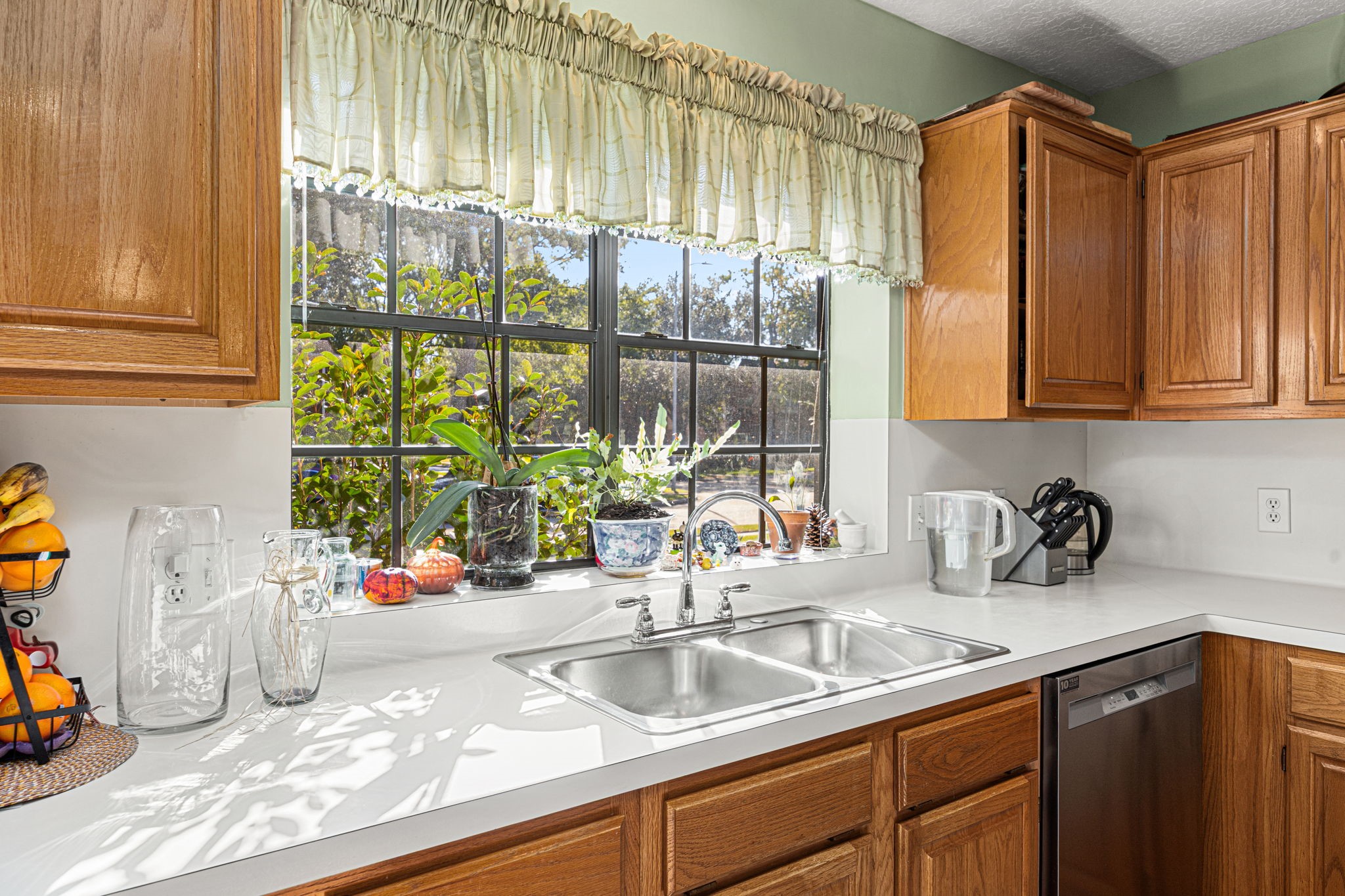 3402 Deeds Road Houston, TX 77084 - Photo 17 of 35 a kitchen with stainless steel appliances granite countertop a sink and a window
