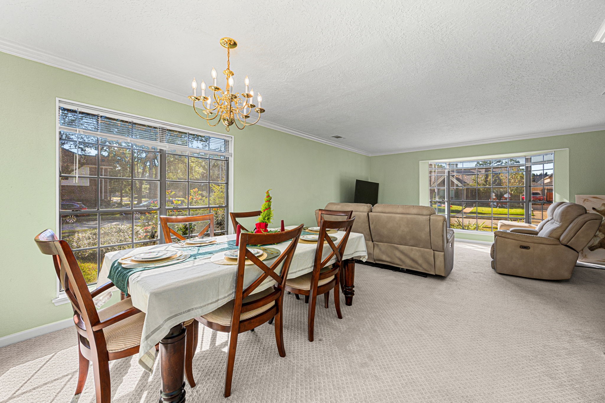 3402 Deeds Road Houston, TX 77084 - Photo 20 of 35 a view of a dining room with furniture a chandelier and large windows