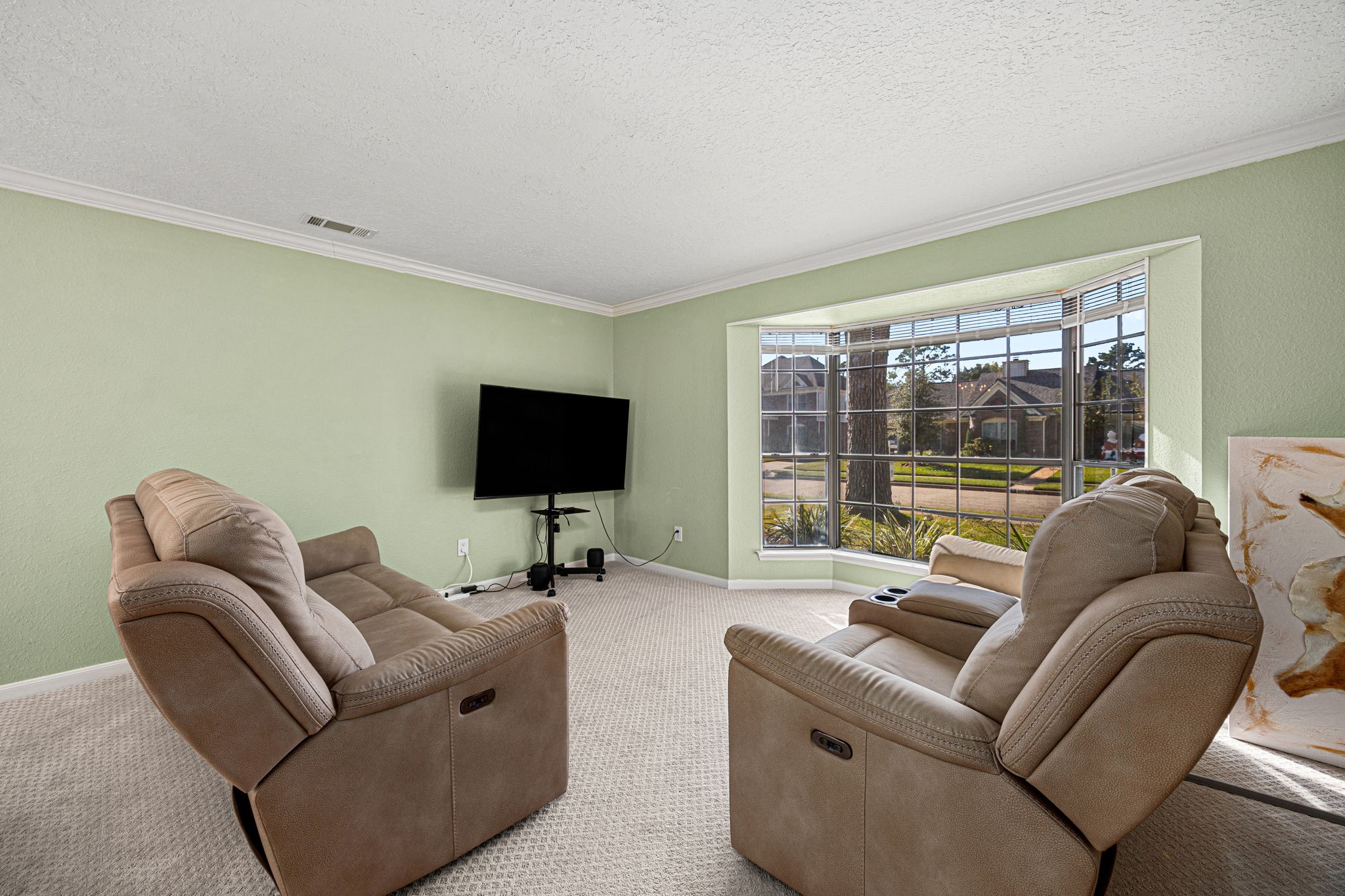 3402 Deeds Road Houston, TX 77084 - Photo 21 of 35 a living room with furniture and a flat screen tv