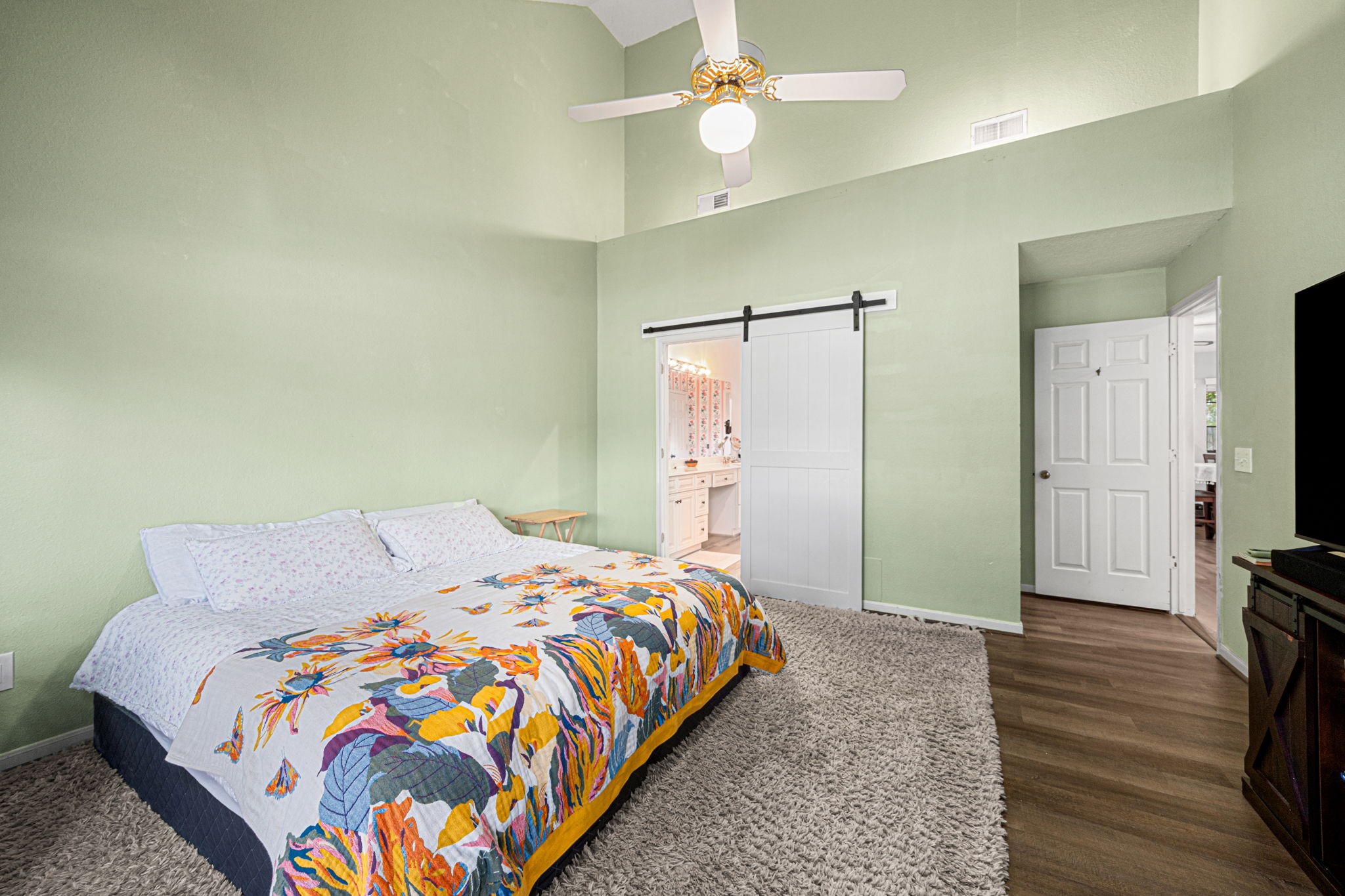 3402 Deeds Road Houston, TX 77084 - Photo 25 of 35 a bedroom with a bed and a flat tv screen on a dresser