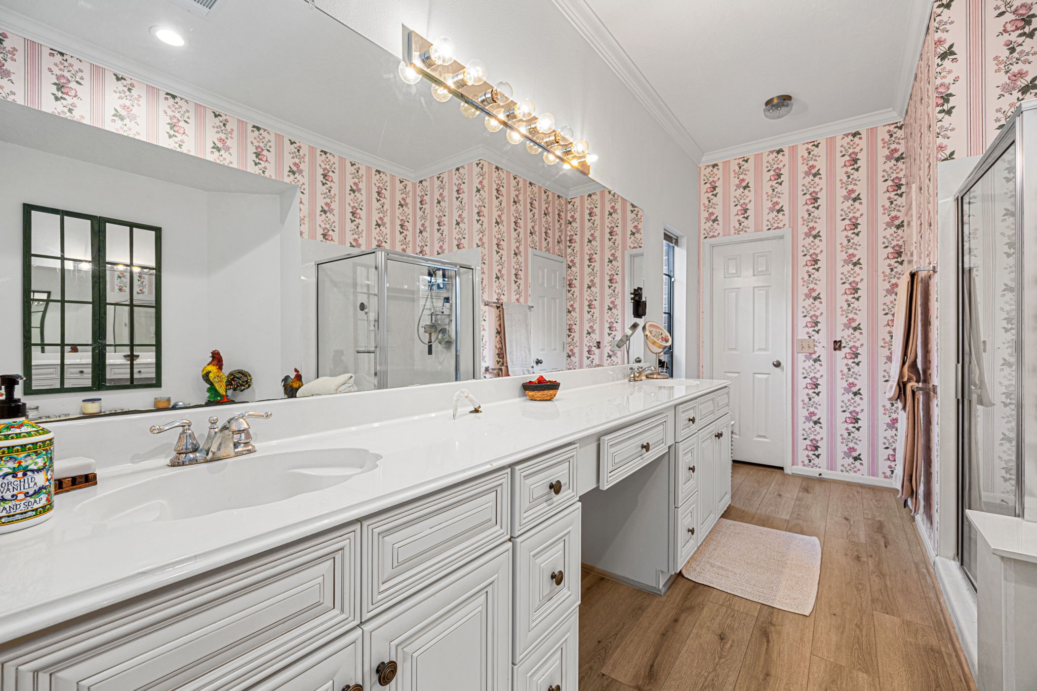3402 Deeds Road Houston, TX 77084 - Photo 26 of 35 a spacious bathroom with double vanity sink a mirror a shower and a bathtub